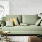 Modernes Joka Schlafsofa mit grauem Stoffbezug und ausziehbarer Liegefläche für komfortables Schlafen.