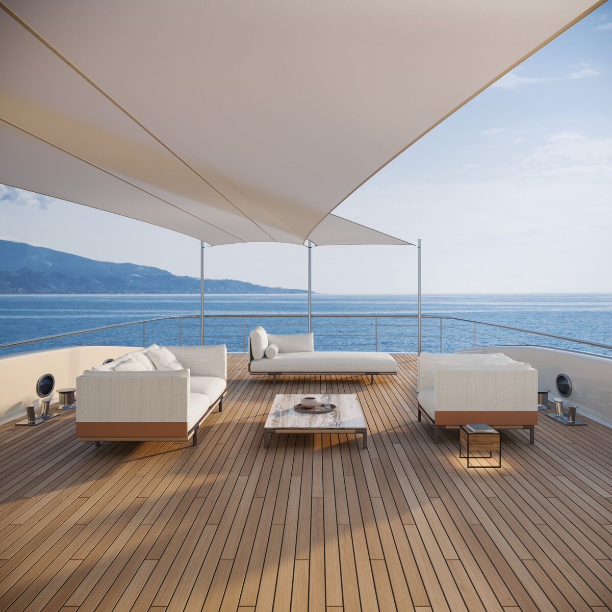 Baia Outdoor-Sofa von Ethimo mit hellen Kissen für stilvolle Gärten und Terrassen.